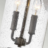 Introducing the Willoughby 2 Light Wall Lantern in Oil Rubbed Bronze, featuring a vintage-style design with two candle-shaped bulbs housed within clear seeded glass, accented by delicate air bubbles for an elegant rustic appearance. The oil-rubbed bronze finish enhances its timeless charm, making it a versatile choice for outdoor spaces.