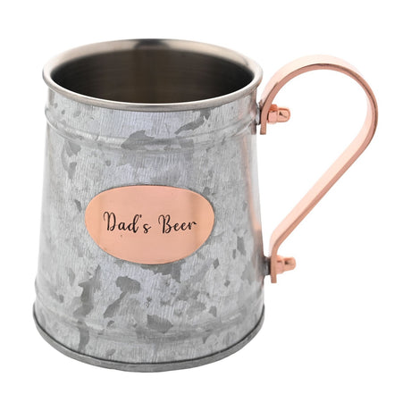 Silver-grey iron Moscow Mule mug with mottled finish, copper handle, and oval copper "Dad's Beer" plaque, shown on a plain white background.
