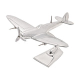 10in Spitfire model ornament in polished silver aluminium with three-blade propeller and curved tail fin, mounted on a stand against a white background.