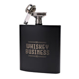 Matt black 6oz hip flask with "Whiskey Business" lettering and knot motif, shown with its hinged cap and stainless steel funnel attached, on a plain white background.