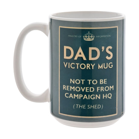 White stoneware mug with wartime poster-style print in deep teal, reading "Dad's Victory Mug, not to be removed from Campaign HQ (the shed)" beneath a crown and Ministry of Information heading.
