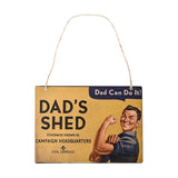Yellow rectangular metal wall plaque with jute hanging cord, reading "Dad's Shed, Campaign Headquarters" beside a flexing man graphic, on a plain white background.