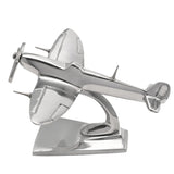 Spitfire model metal ornament, 15.5cm, in polished silver finish with elliptical wings, three-bladed propeller, and cockpit canopy detail, mounted on a curved stand against a white background.