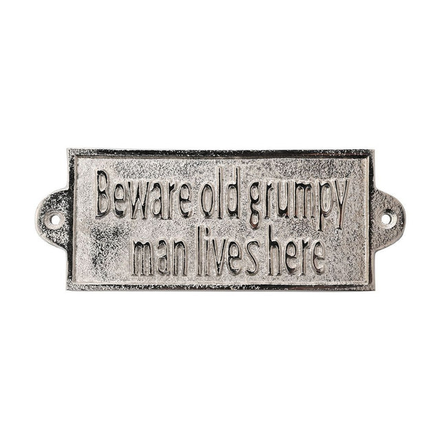 Rectangular silver metal wall plaque with raised text "Beware old grumpy man lives here" on a distressed background, with fixing holes in rounded end tabs, shown on a white background.