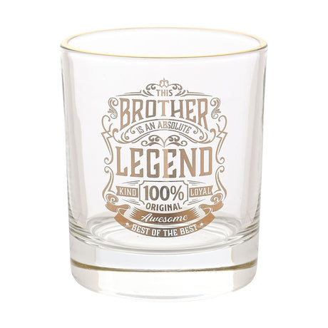 Clear glass tumbler with a gold rim, featuring gold-toned "This Brother Is an Absolute Legend" text and flourish design, photographed on a plain white background.