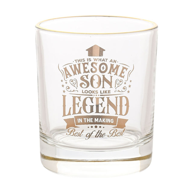 Clear round glass tumbler with a gold rim, featuring gold-printed text "Awesome Son... Legend in the Making, Best of the Best" with star and scroll details, on a plain white background.