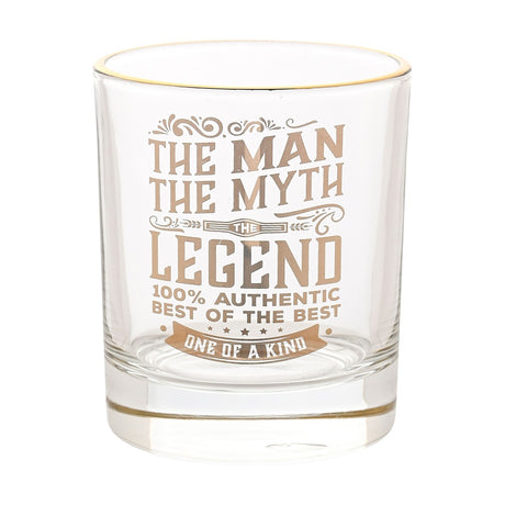 Clear glass tumbler with gold rim, printed in gold with "The Man, The Myth, The Legend, One of a Kind" lettering and flourishes, shown on a plain white background.