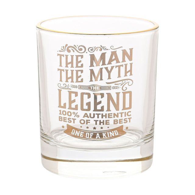 Clear glass tumbler with gold rim, printed in gold with "The Man, The Myth, The Legend, One of a Kind" lettering and flourishes, shown on a plain white background.