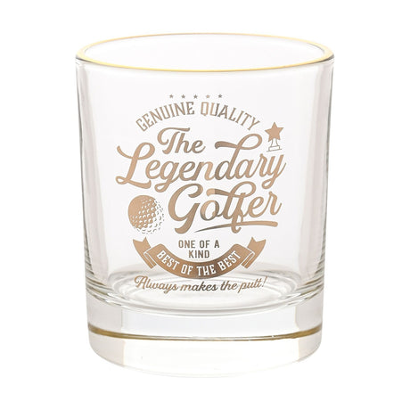 Clear round glass tumbler with a gold rim, printed in gold script "The Legendary Golfer" with golf ball, trophy icon and banner text, shown on a plain white background.