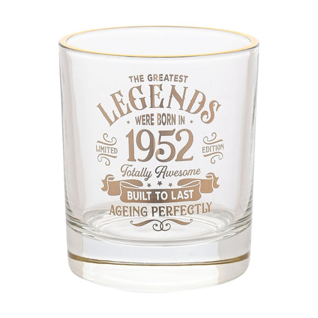 Clear glass tumbler with gold rim, printed in gold with "The Greatest Legends Were Born In 1952, Totally Awesome, Built To Last, Ageing Perfectly," shown on a plain white background.