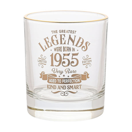 Clear round glass tumbler with a gold rim, featuring a vintage-style gold label reading The Greatest Legends Were Born in 1955, Very Rare, Aged to Perfection, Kind and Smart, on a white background.