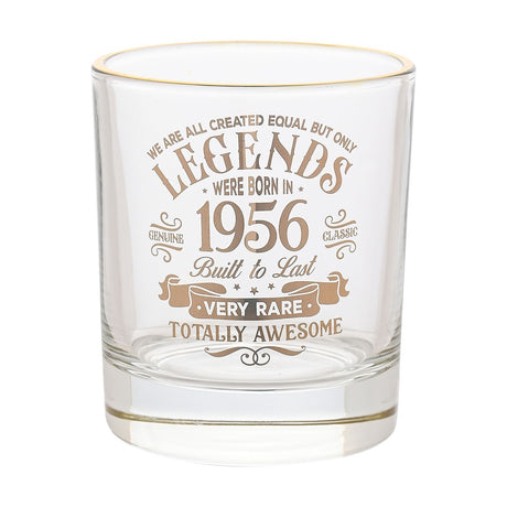 Clear glass tumbler with gold rim, printed in gold text "Legends were born in 1956, Built to Last, Very Rare, Totally Awesome," on a plain white background.