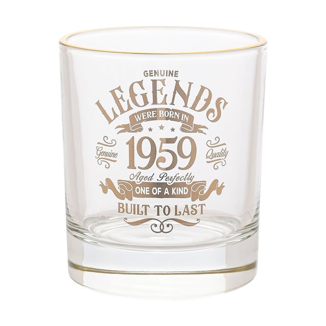 Clear glass tumbler with a gold rim, printed in gold text "Legends were born in 1959, Aged Perfectly, One of a Kind, Built to Last" within a vintage scroll design, shown on a plain white background.