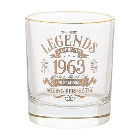 Clear glass tumbler with gold rim, featuring gold "The Best Legends Were Born In 1963" print and "Ageing Perfectly" text, shown on a plain white background.