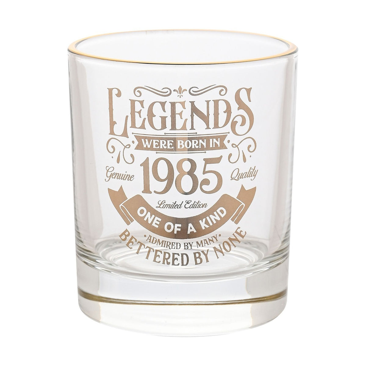 Clear glass tumbler with gold rim, featuring gold text "Legends Were Born in 1985, One of a Kind, Admired by Many, Bettered by None" on a plain white background.