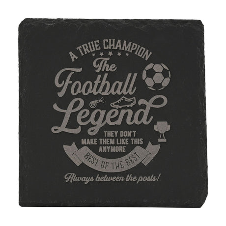 Square black slate coaster engraved with "A True Champion, The Football Legend" text, football, whistle, boot and trophy icons, set against a plain white background.