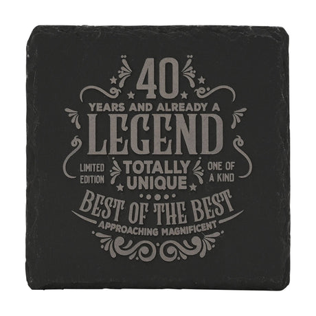 Square black slate coaster engraved with "40 Years and Already a Legend" in grey lettering, stars and flourish details, shown on a white background.