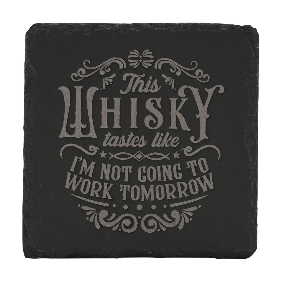 Square black slate coaster engraved with grey lettering reading "This WHISKY tastes like I'M NOT GOING TO WORK TOMORROW", framed by scrolled flourishes and stars, shown on a plain white background.