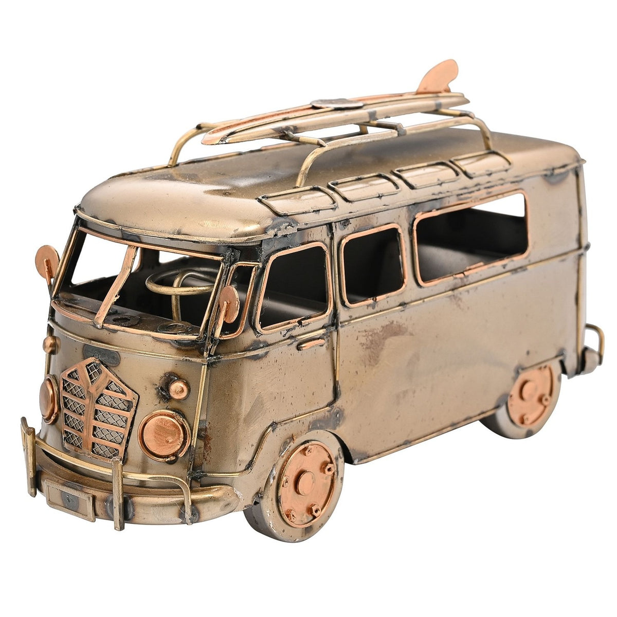 Weathered bronze metal campervan figurine with roof-rack surfboard, mesh grille, round headlamps, copper-edged window frames and visible steering wheel, shown on a plain white background.