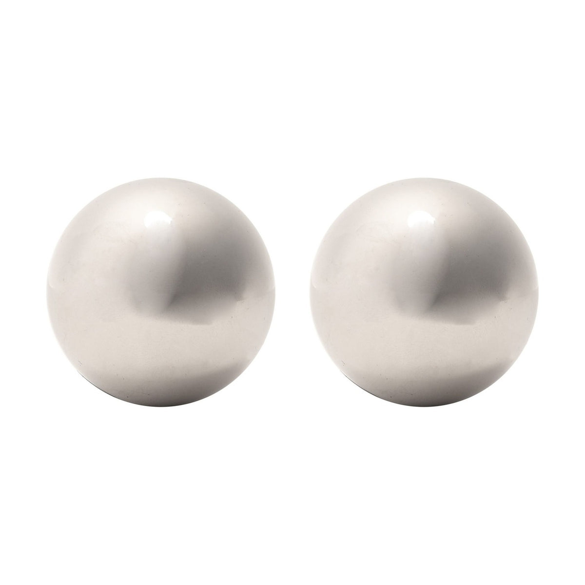 Two large round metal whisky stones in polished silver, smooth spherical chilling balls shown on a plain white background.