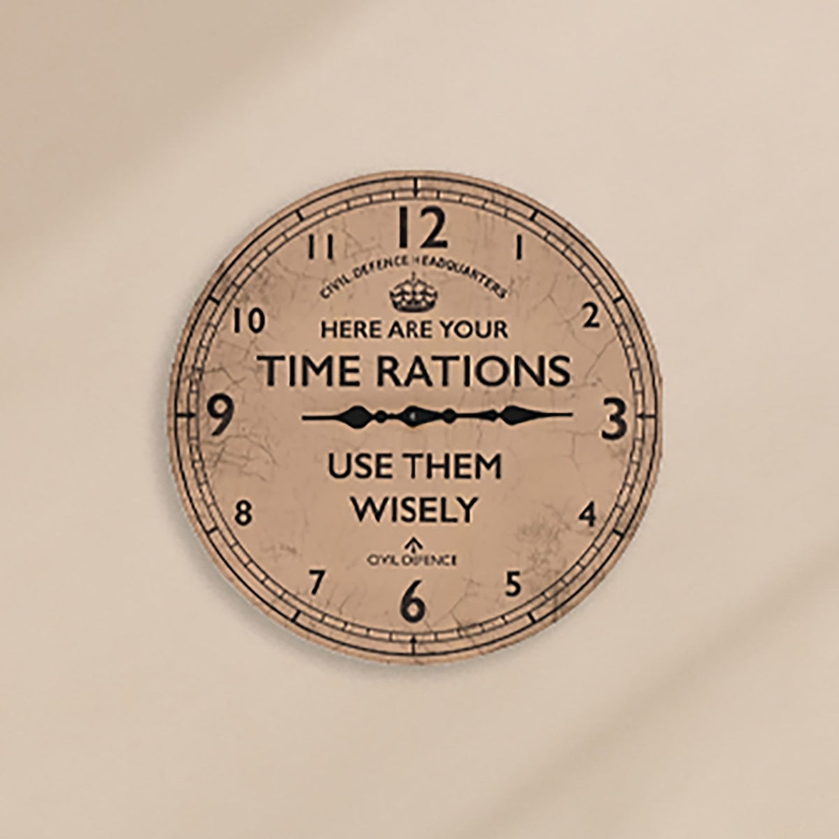 Round wall clock, 30cm, brown crackled face with black numerals, crown emblem and "Here Are Your Time Rations, Use Them Wisely" Civil Defence text, black clock hands.