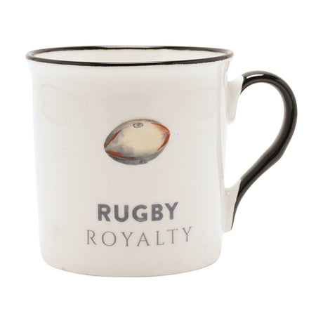 White porcelain mug with black rim and handle, printed with a rugby ball illustration and "RUGBY ROYALTY" text, shown on a plain white background.