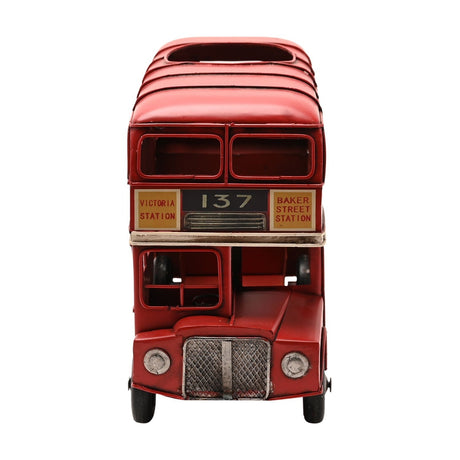 Red metal London double decker bus wine bottle holder with oval roof opening, route 137 display, open windows, silver grille, headlamps, and black tyres, on white background.