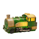Steam train table lamp in green with cream panels, speckled weathering, raised rivet detail, black wheels, silver coupling rods and red buffers, lit windows, on a plain white background.