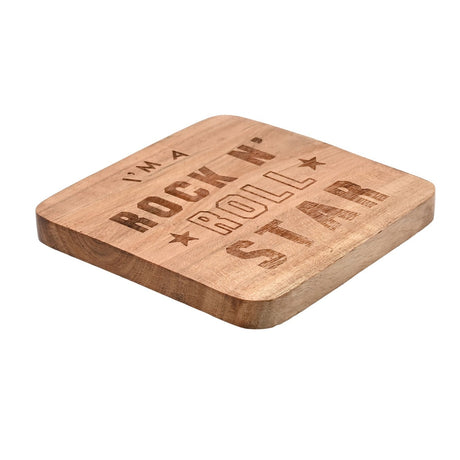 Rounded square wood coaster in tan with visible grain, engraved "I'm A Rock N' Roll Star" text and star accents in dark brown, shown on a plain white background.