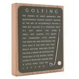 Golf wooden plaque with a green panel on a natural wood block, featuring white "Golfing" text and a raised golf club and ball, shown on a plain white background.