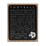 Rectangular wooden wall plaque with natural wood border and black panel, "FOOTBALL" text and printed passage in white capitals, plus a football graphic in the lower corner.