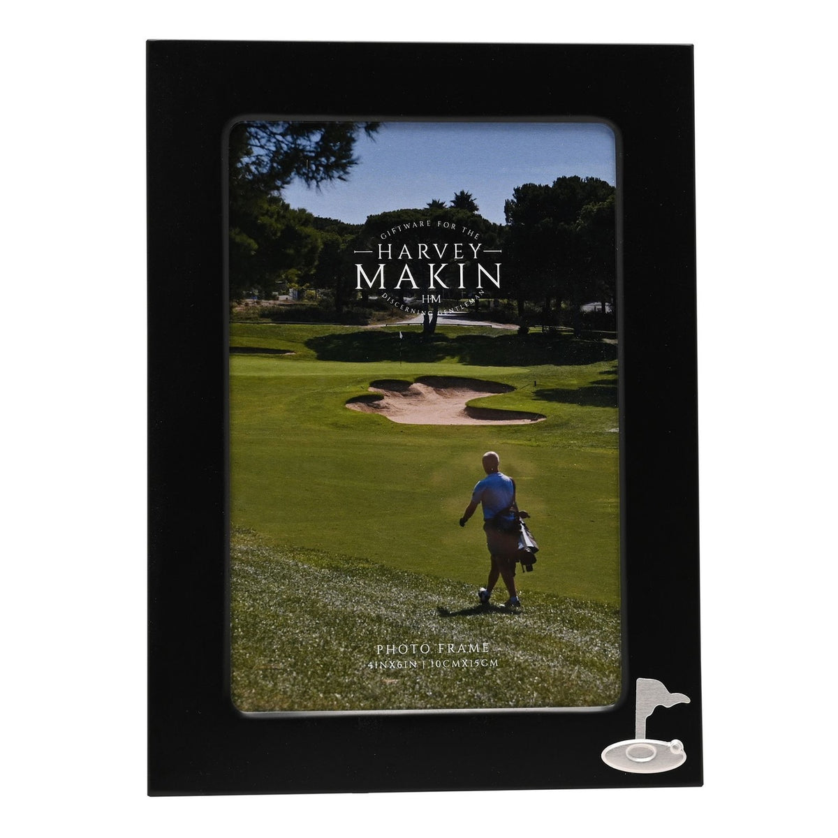 Rectangular matt black metal photo frame with a silver golf flag and ball emblem in the lower right corner, holding a 6 x 4in photo of a golfer on a course.