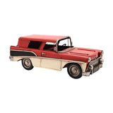 Retro Estate Car Metal Figurine with Tail Fins in red with cream lower panels, silver bumpers, grille, headlamps and trim, shown on a plain white background.
