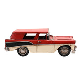 Retro estate car metal figurine in red with cream lower panels, tail fins, silver bumpers, grille and hubcaps, shown side-on against a plain white background.