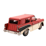Retro Estate Car metal figurine in red with cream lower panels, showing tail fins, silver bumpers, hubcaps and wing mirror, photographed from the rear on a plain white background.