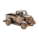 Vintage Pickup Truck Metal Ornament Figurine in silver with copper-tone grille, headlamps and hubcaps, featuring an open bed, rounded cab and running boards, on a plain white background.