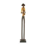 Hill Interiors Standing Saxophonist Figurine in brown resin, tall slim jazz musician with yellow shirt and hat on a square base, plain white background.