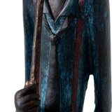 Close-up of the Hill Interiors Standing Trumpeter Figurine in resin, showing the blue-toned jacket with red detailing and hand gripping the trumpet.