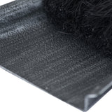 Close-up of the Hill Interiors Brushed Steel Crook Top Hearth Tidy Set shovel pan in silver metal with black brush bristles resting alongside.