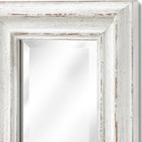 Close-up of the Hill Interiors Narrow Antique White Framed Wall Mirror, showing the distressed white wooden frame corner and bevelled glass.
