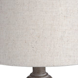 Close-up of the Hill Interiors Wooden Table Lamp in beige, showing the woven linen-look shade and turned wooden base detail.