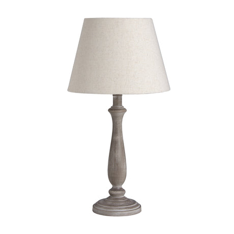 Hill Interiors Wooden Table Lamp in beige with a turned wood base and tapered linen shade, shown on a plain white background.