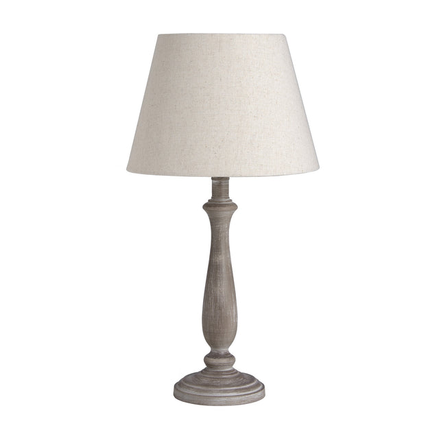 Hill Interiors Wooden Table Lamp in beige with a turned wood base and tapered linen shade, shown on a plain white background.