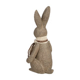Hill Interiors Small Winter Bunny Rabbit Figurine in brown resin, side view showing upright pose, tall ears and burlap neck tie on a white background.