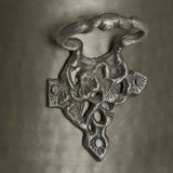 Close-up of Hill Interiors Antique Pewter Coal Bucket showing the ornate cast metal mount and twisted swing handle in a soft silver finish.
