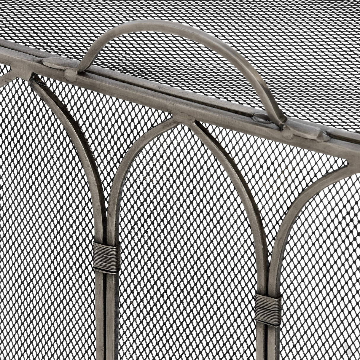 Close-up of the Hill Interiors Gothic Fire Screen showing arched tracery detail, fine mesh panels and an antique pewter finish in soft aged silver.