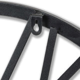 Close-up of Hill Interiors Skeleton Heart Wall Clock showing metal frame edge, spoke-like bars, textured silver-grey finish and keyhole hanging slot.