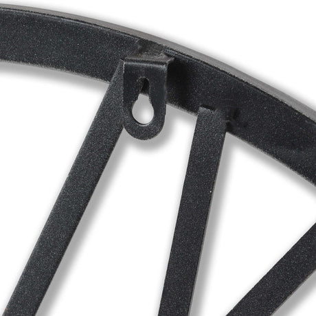 Close-up of Hill Interiors Skeleton Heart Wall Clock showing metal frame edge, spoke-like bars, textured silver-grey finish and keyhole hanging slot.