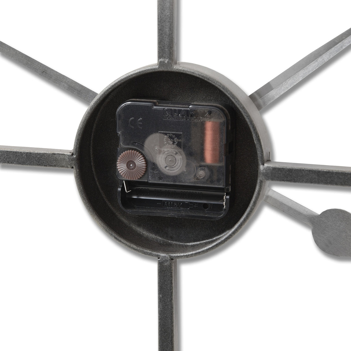 Close-up of the Hill Interiors Large Silver Skeleton Wall Clock's central hub, showing the quartz movement housing and metal spokes in a silver finish.