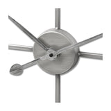 Close-up of the Hill Interiors Large Silver Skeleton Wall Clock centre, showing the brushed silver hub, slim hands and radiating metal spokes.